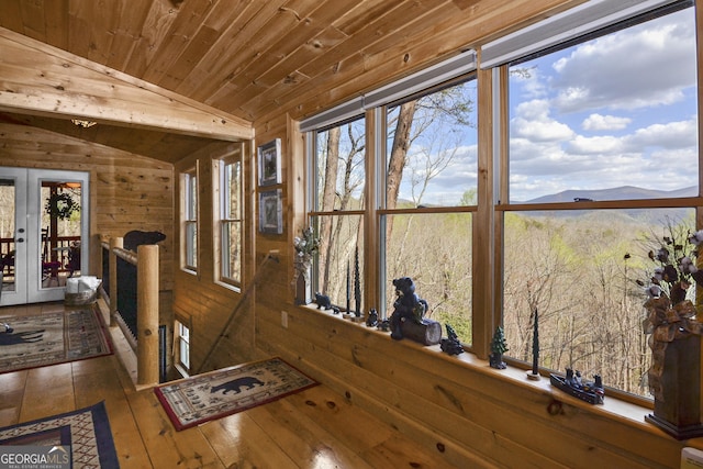 interior space featuring a mountain view, french doors, wooden ceiling, and lofted ceiling