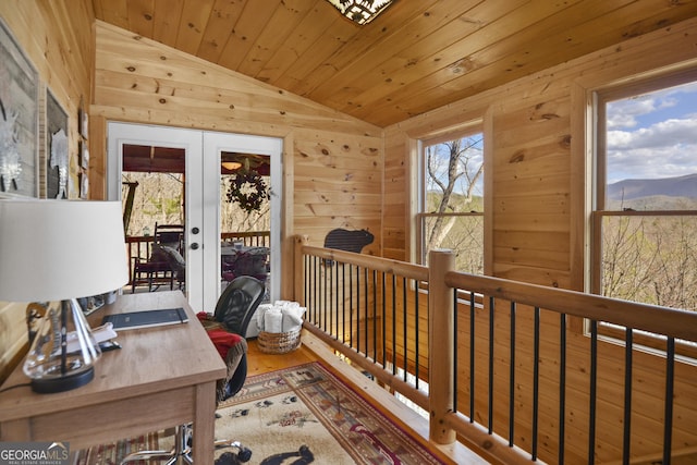 office featuring a mountain view, lofted ceiling, wooden ceiling, french doors, and wood-type flooring