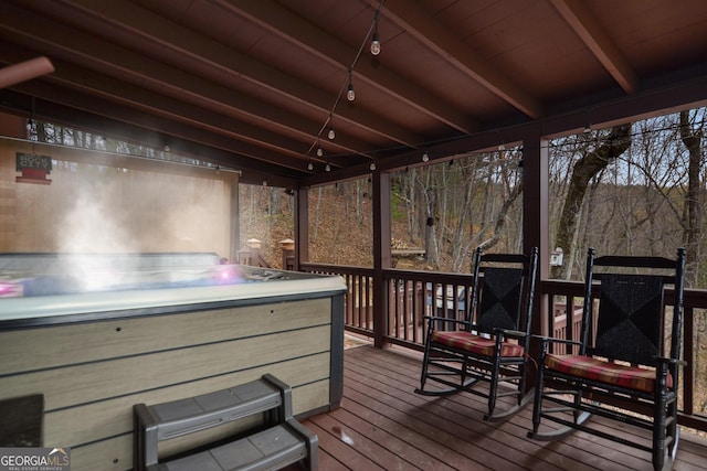 wooden terrace featuring a hot tub