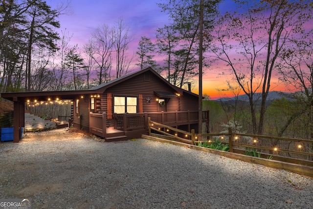 log-style house with a deck