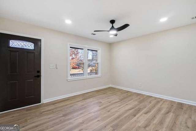 entrance foyer with ceiling fan and light wood-type flooring