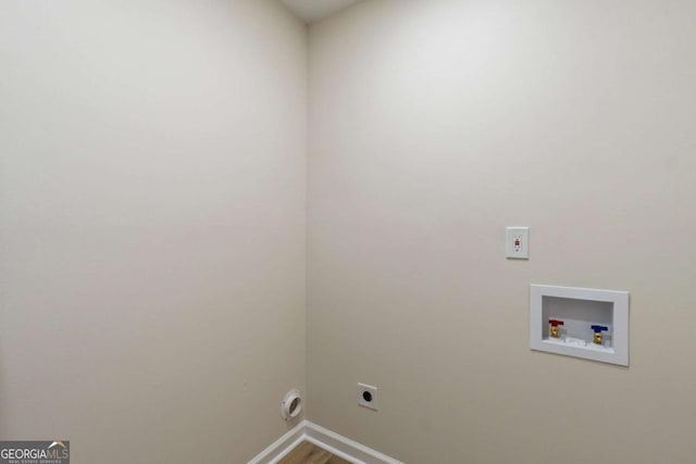 laundry area featuring electric dryer hookup, hookup for a washing machine, and hardwood / wood-style floors