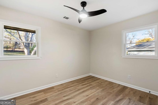 spare room featuring ceiling fan and light hardwood / wood-style floors