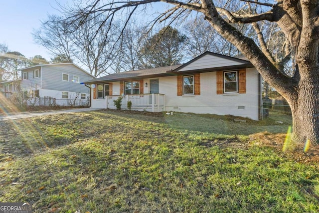 ranch-style house with a porch and a front yard