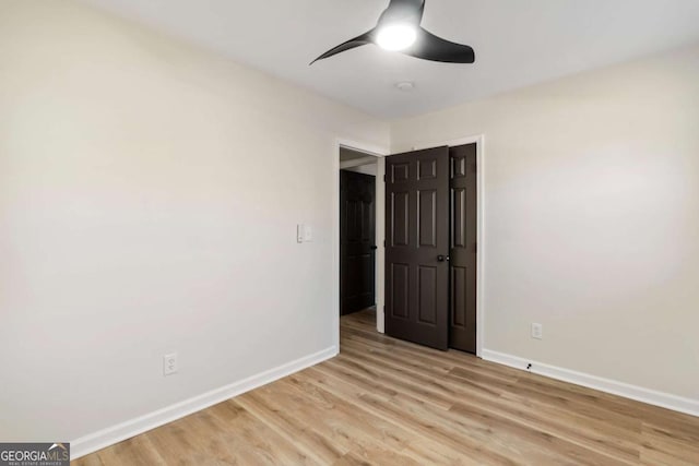 unfurnished bedroom featuring ceiling fan and light hardwood / wood-style flooring