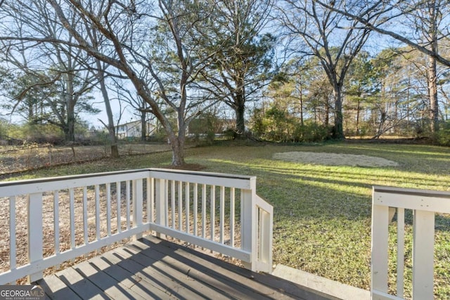 wooden deck with a lawn