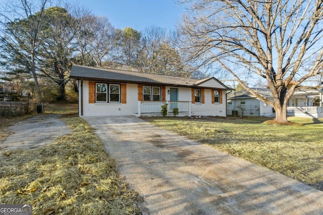 ranch-style home with a front yard