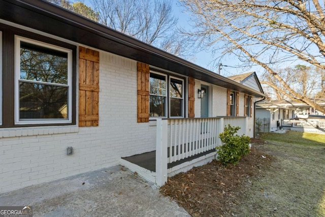 view of property exterior featuring a porch