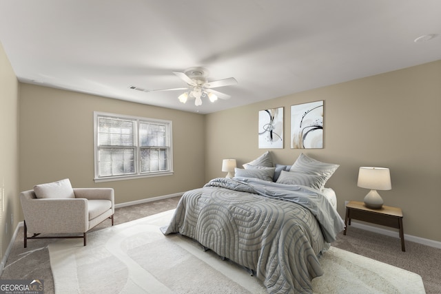 bedroom with ceiling fan and carpet floors