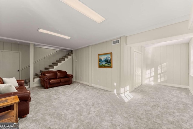 basement featuring light carpet