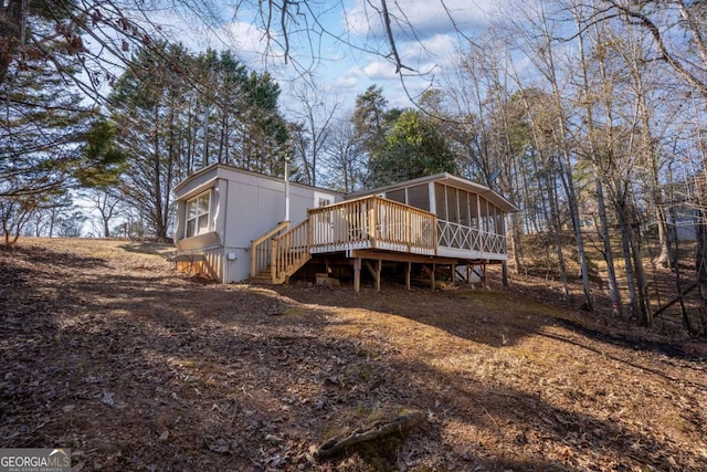 rear view of property with a deck