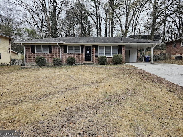 ranch-style house with a front yard and a carport