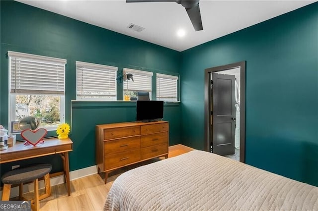 bedroom with ceiling fan and light wood-type flooring