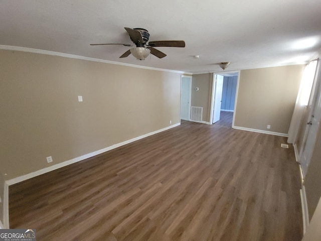 empty room with ceiling fan, crown molding, and hardwood / wood-style flooring