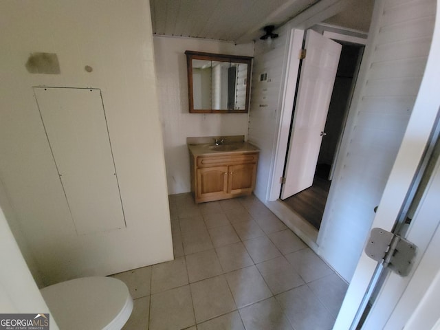 bathroom featuring tile patterned floors, toilet, and vanity