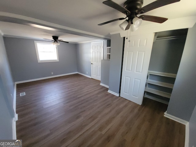 unfurnished bedroom with ceiling fan, dark hardwood / wood-style flooring, and crown molding