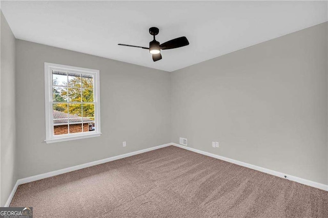 empty room with carpet floors and ceiling fan