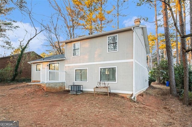 rear view of property featuring central air condition unit