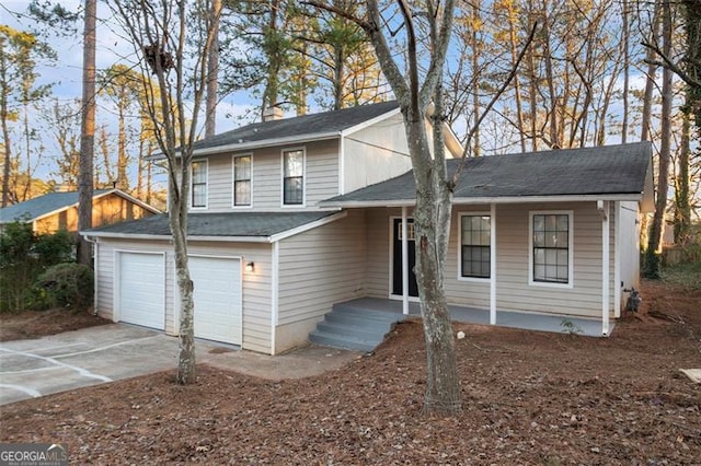 view of front facade featuring a porch and a garage