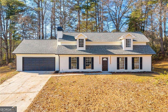 view of front of home featuring a front yard and a garage