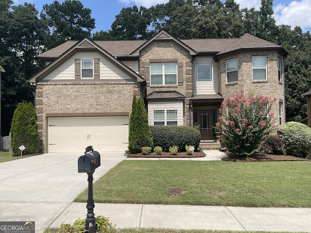 view of front of house with a front yard and a garage