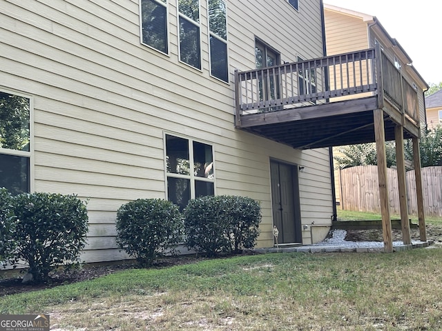 view of exterior entry featuring a deck