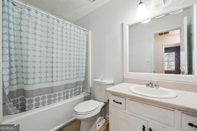 full bathroom with shower / bath combo, vanity, a textured ceiling, and toilet