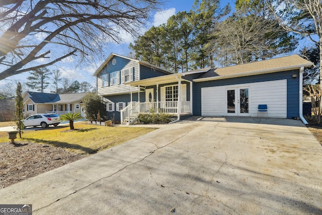 view of front facade featuring a front lawn, a porch, and french doors