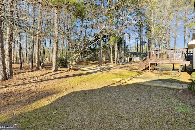 view of yard with a wooden deck