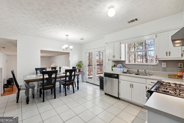 kitchen featuring hanging light fixtures, white cabinets, stainless steel dishwasher, and sink