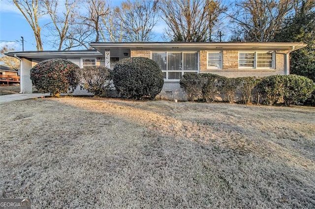 single story home featuring a carport