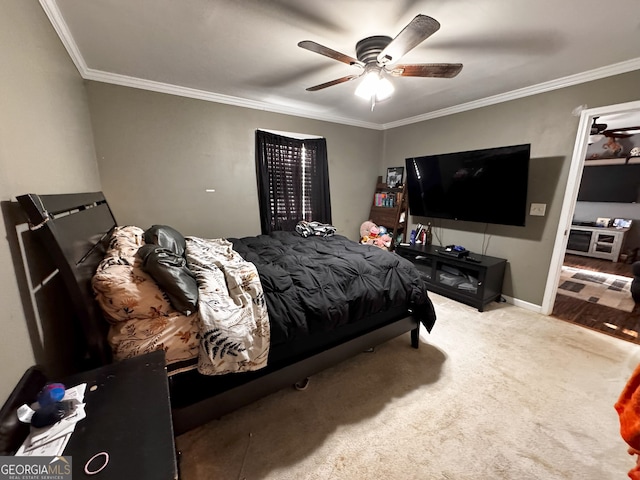 bedroom featuring carpet flooring, ceiling fan, and crown molding