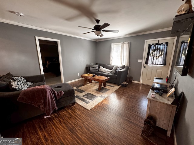 living room with ceiling fan, crown molding, and dark wood-type flooring