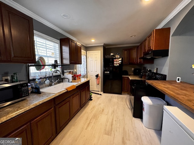 kitchen featuring sink, black appliances, and ornamental molding