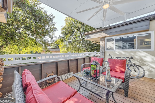 deck featuring outdoor lounge area and ceiling fan