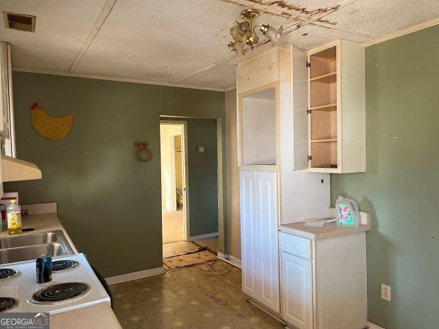 kitchen featuring white cabinets