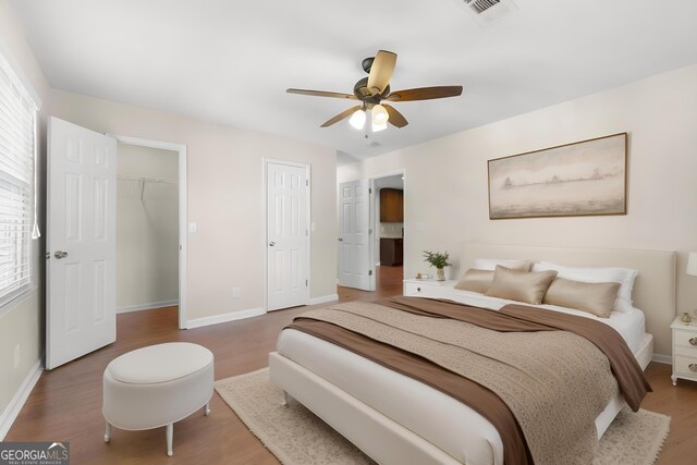 bedroom featuring ceiling fan and hardwood / wood-style flooring