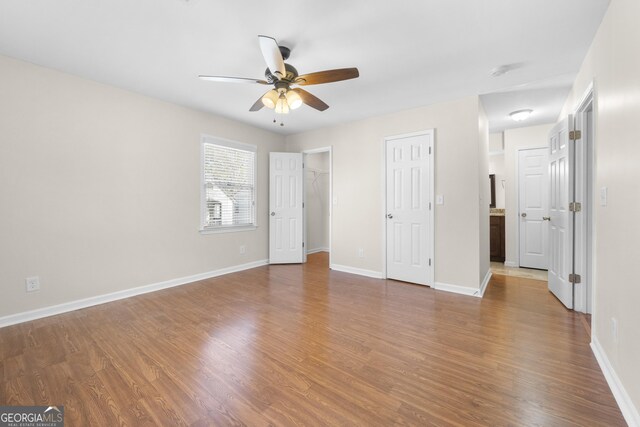 unfurnished bedroom featuring ceiling fan and wood-type flooring