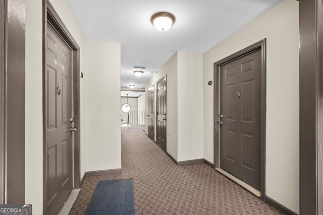 corridor featuring carpet flooring