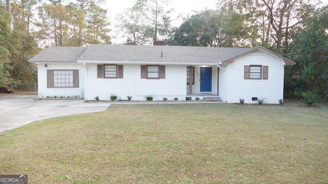 ranch-style house featuring a front lawn