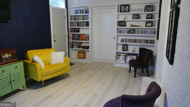 living area with light hardwood / wood-style flooring