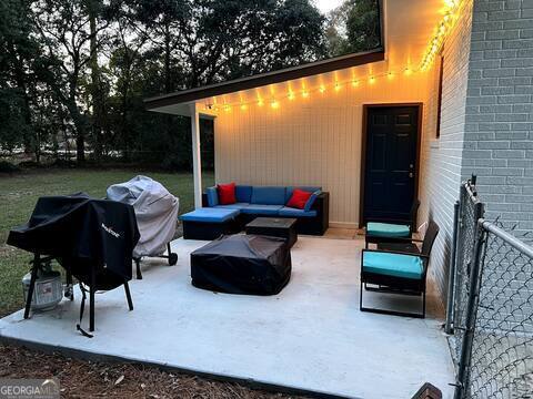 view of patio featuring a grill and an outdoor living space