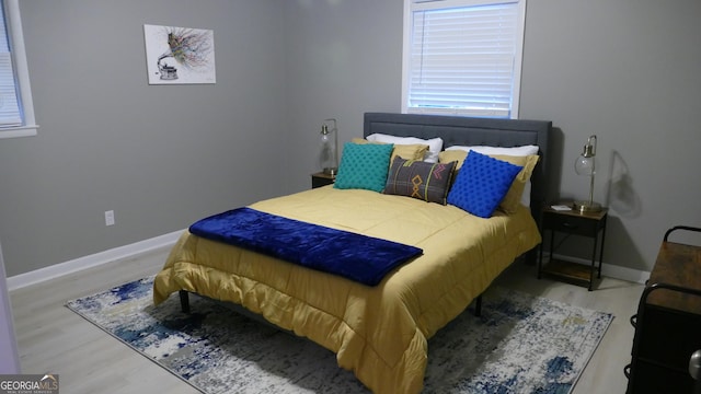 bedroom with hardwood / wood-style floors