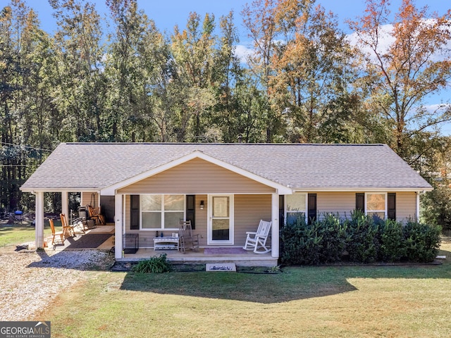 view of front facade with covered porch and a front yard