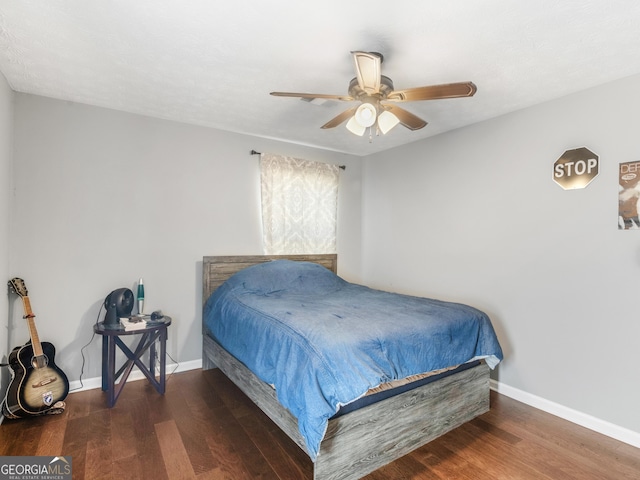 bedroom featuring ceiling fan and dark wood-type flooring