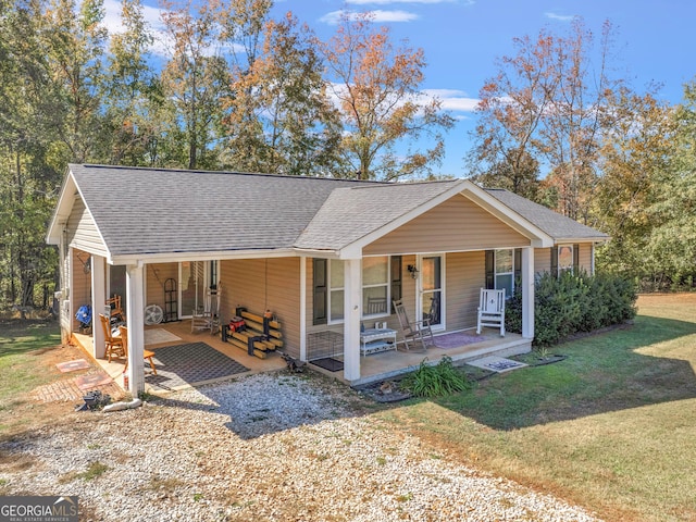 view of front of house featuring a front lawn and a porch