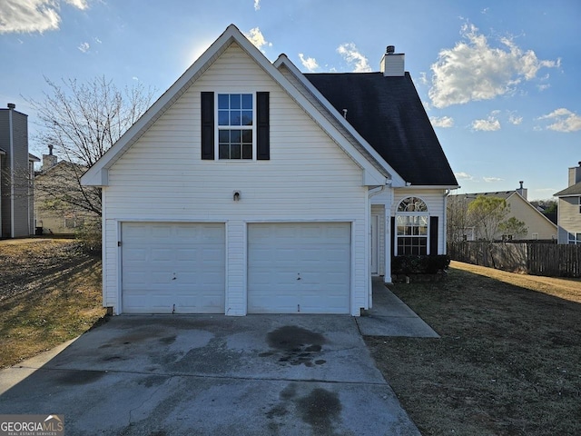 view of property exterior featuring a garage