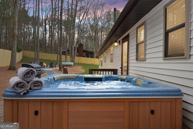 exterior space featuring a hot tub