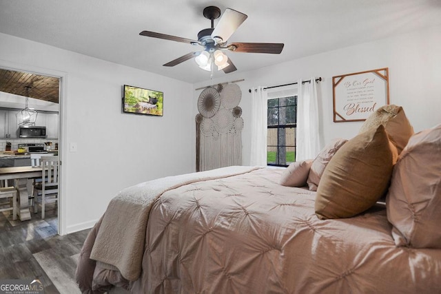 bedroom featuring ceiling fan and dark wood-type flooring