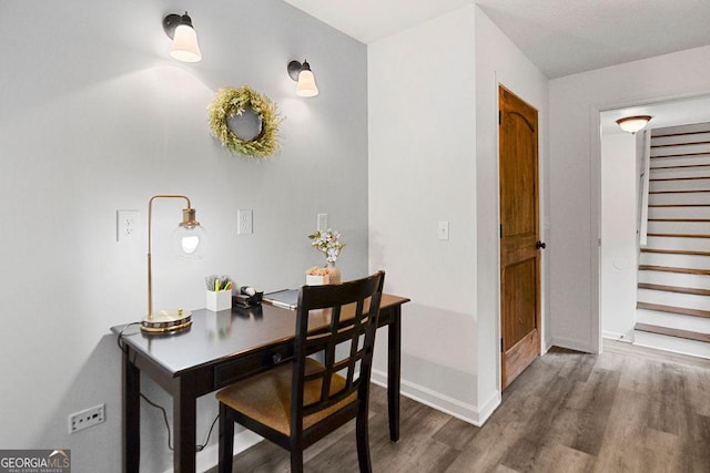 dining area featuring dark hardwood / wood-style flooring